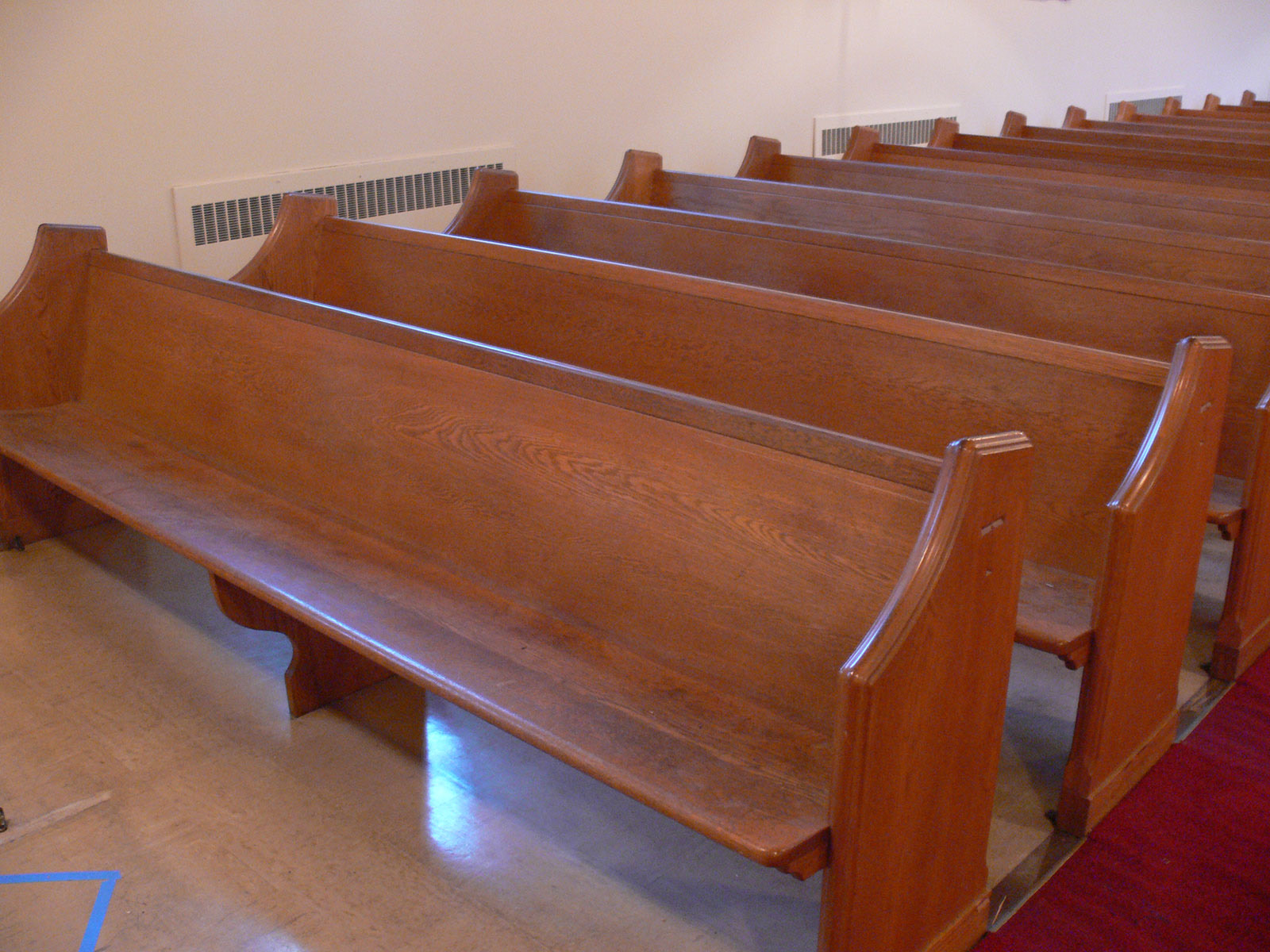 Bench and pew-style cushions rebuilt with new high-density foam in the Atlas workshop — church pew upholstery Montreal