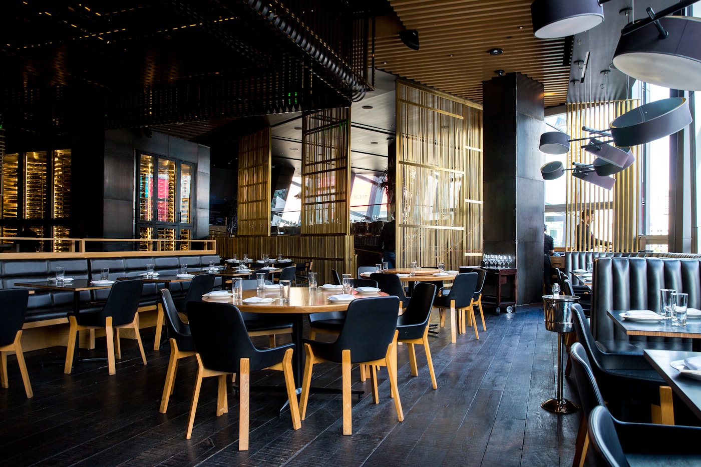 Upscale restaurant interior with custom leather banquette seating — commercial upholstery Montreal by Atlas Upholstering