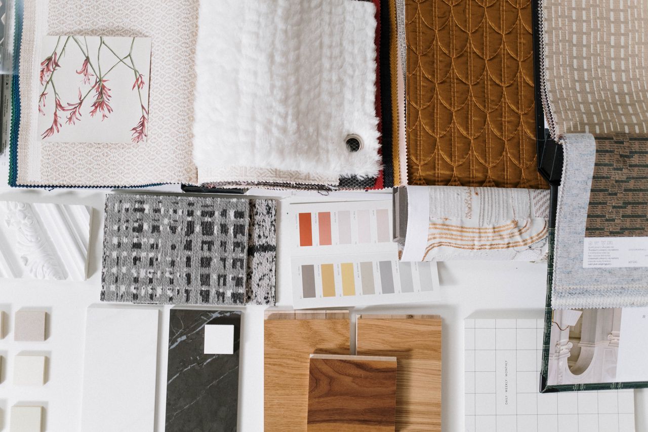 Upholstery fabric swatches in a range of colours and textures — how to choose the right fabric for reupholstery in Montreal