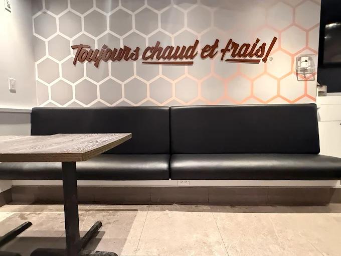 Black leather restaurant banquette — commercial upholstery Montreal by Atlas Upholstering