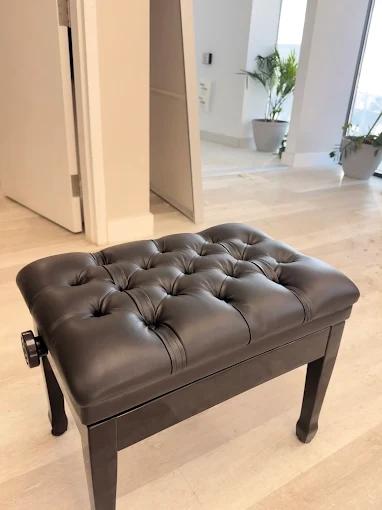 Leather sofa with restored seam and re-tied springs — Montreal sofa repair by Atlas Upholstering