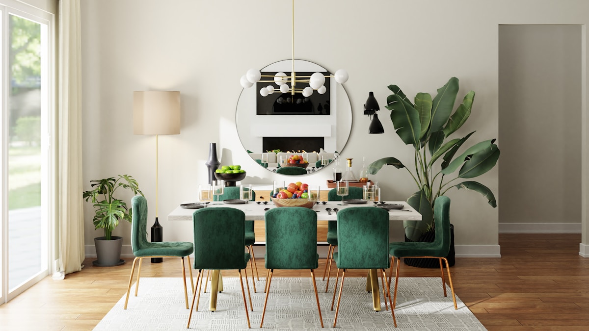 Emerald velvet upholstered dining chairs with gold legs at formal dining table — dining chair reupholstery Montreal